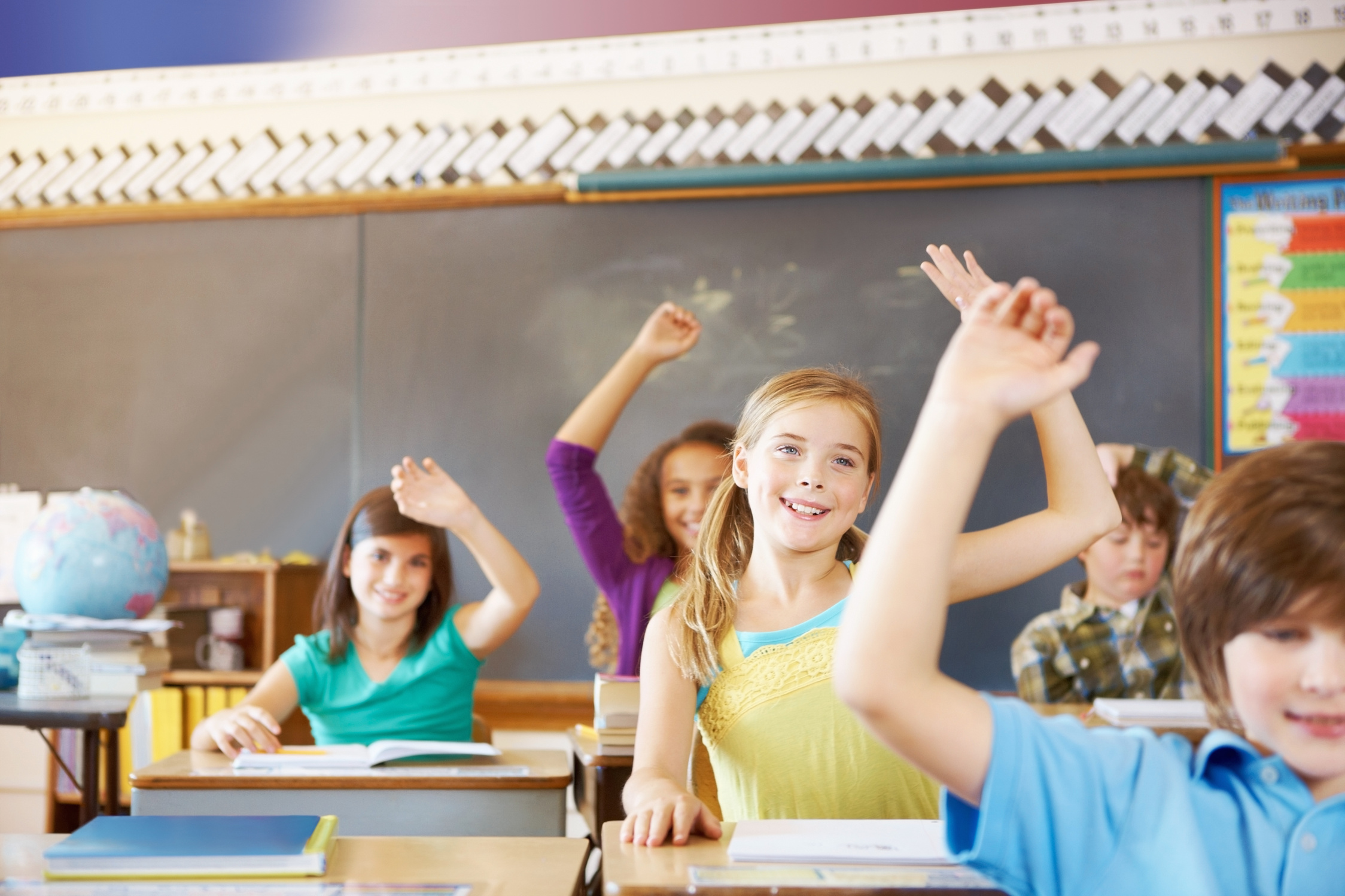 School children raising hands
